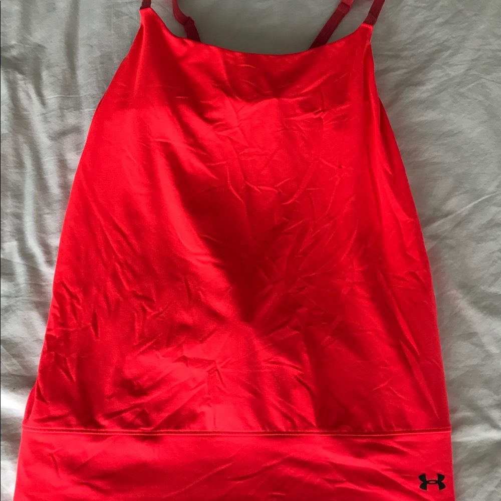 Used. Under armour top. Not so neon.